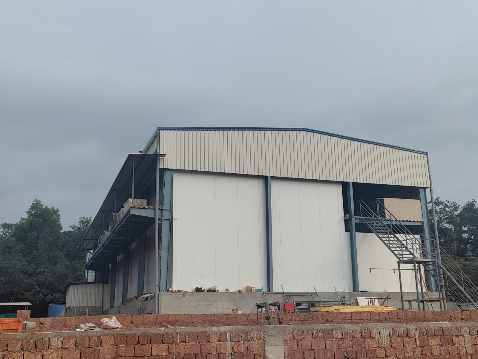Steel structure industrial warehouse building with insulated wall panels in Kerala